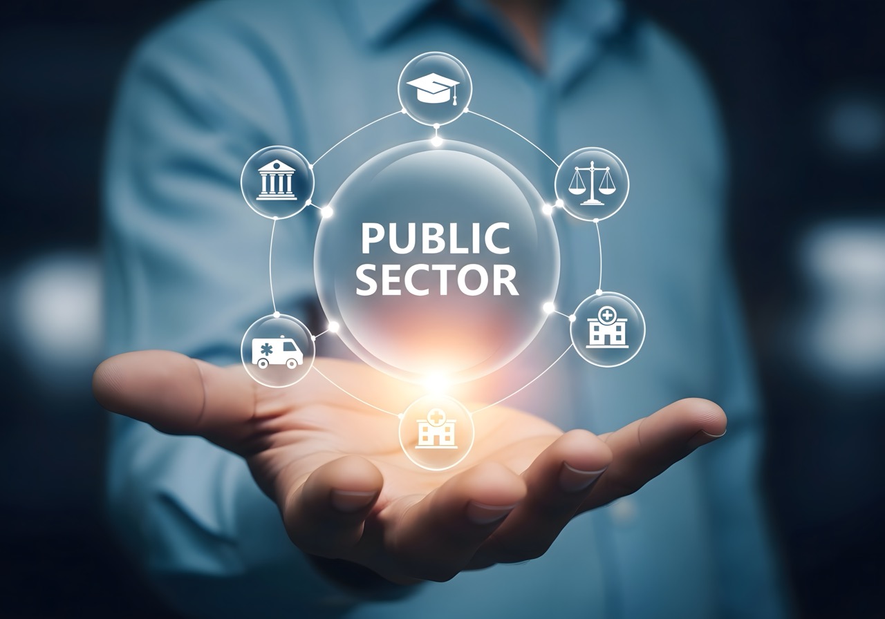 Person holding public sector icons representing government services in their open hand close up